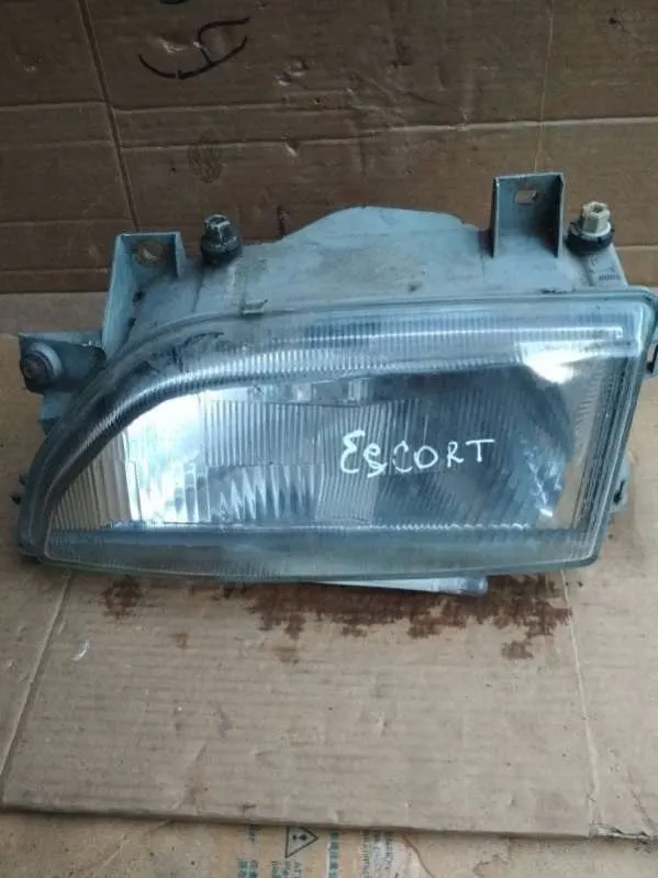 Фара левая Ford Escort (North America) 2 поколение