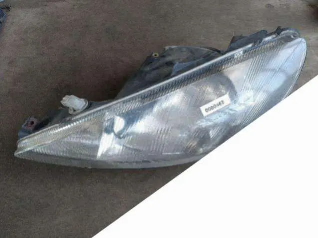 Фара левая Peugeot 206 1 поколение